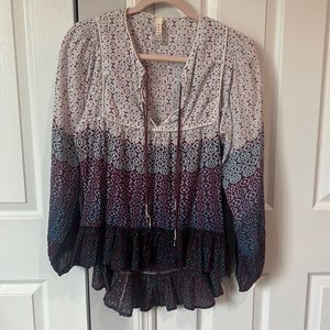 Raga top with ruffle bottom and cute ties at neckline